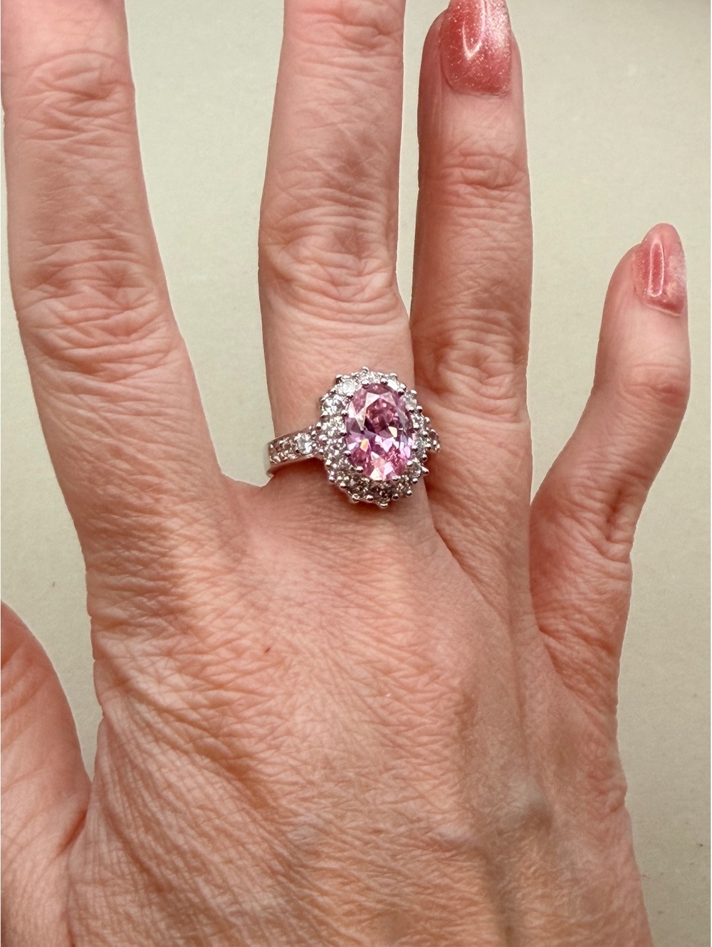 Silver tone pink oval halo ring